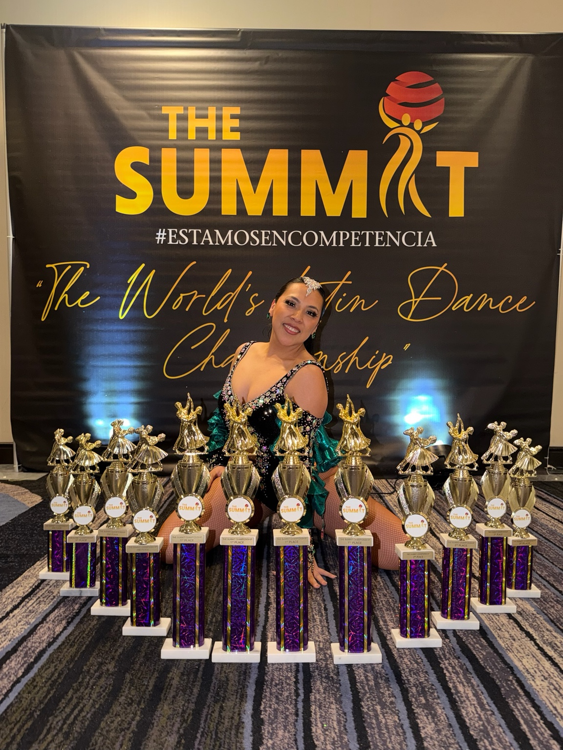 World Salsa Champion and instructor Noe Lugo with dance championship trophies
