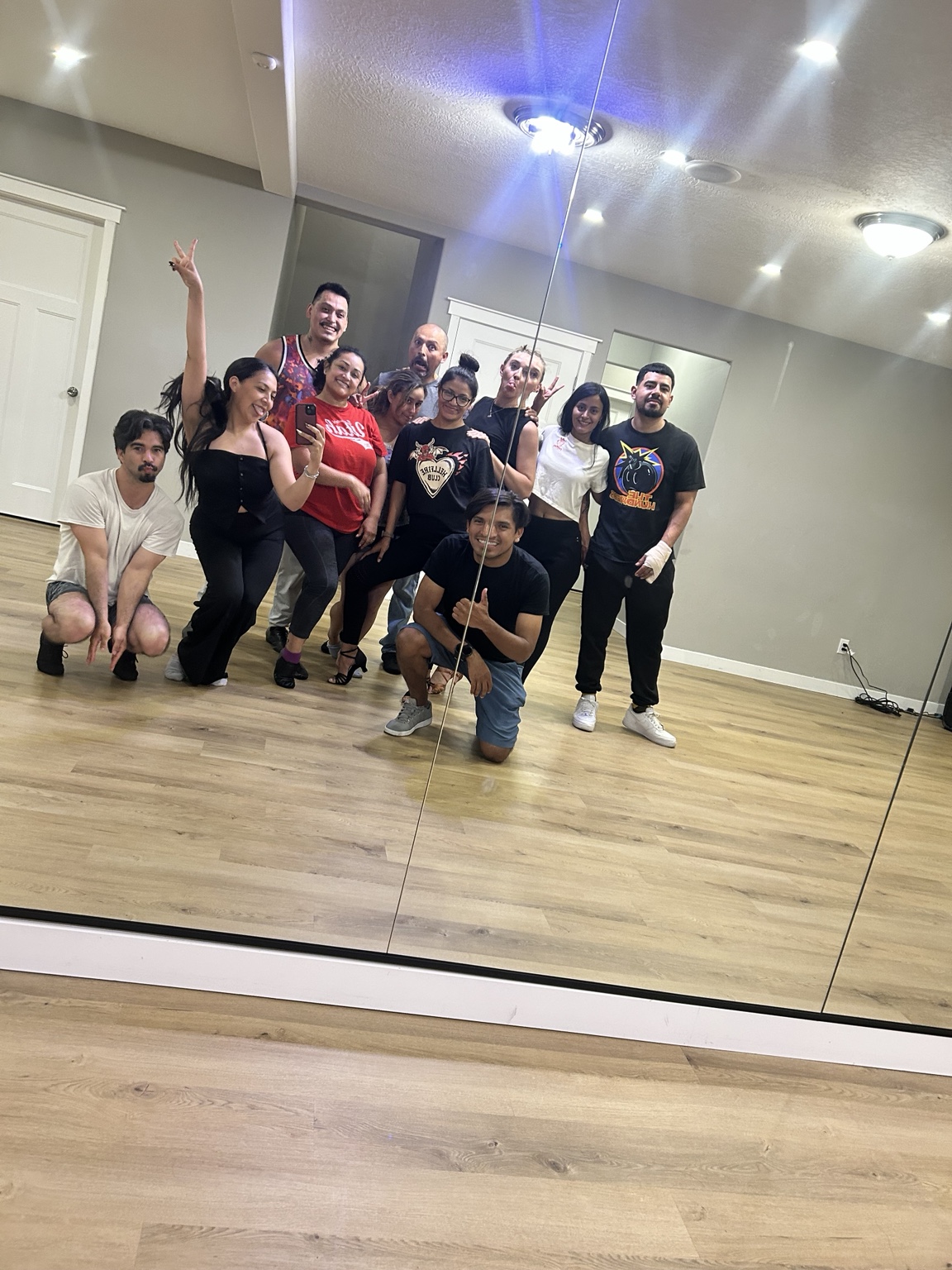 FÉNIX adult Bachata team smiling in rehearsal